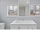 Bright bathroom with a large vanity, big mirror and a window offering natural light at 708 Bobby L. Davis Blvd., Marion, SC 29571