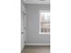 Cozy bedroom with a light gray walls, closet, a window and light colored vinyl plank floors at 708 Bobby L. Davis Blvd., Marion, SC 29571