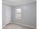 Clean bedroom featuring a large window providing ample natural light and a neutral color palette at 708 Bobby L. Davis Blvd., Marion, SC 29571