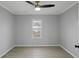 Spacious bedroom with ceiling fan, large window offering natural light, and neutral paint at 708 Bobby L. Davis Blvd., Marion, SC 29571