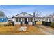Charming one-story home featuring black-and-white accents, a covered carport, and a well-maintained lawn at 708 Bobby L. Davis Blvd., Marion, SC 29571