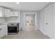 Bright kitchen featuring white cabinets, stainless steel appliances, and light gray walls at 708 Bobby L. Davis Blvd., Marion, SC 29571