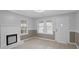 Cozy living room with decorative fireplace and ample natural light through several windows at 708 Bobby L. Davis Blvd., Marion, SC 29571