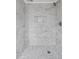 Elegant shower boasts marble-patterned tiling, a shower niche, and a stylish shower head at 708 Bobby L. Davis Blvd., Marion, SC 29571