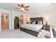 Inviting main bedroom showcasing a rustic bed frame, nightstands, and ensuite bath at 818 Mourning Dove Dr., Myrtle Beach, SC 29577