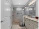 Bathroom with double vanity, granite countertop, large tiled shower and a view into the water closet at 8217 Sandlapper Way, Myrtle Beach, SC 29572