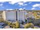 Stunning aerial view of the condo building with manicured landscaping, parking, and waterfront views at 9547 Edgerton Dr. # Ph1005, Myrtle Beach, SC 29572