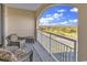Balcony with seating, overlooking a golf course, and beautiful skies at 9547 Edgerton Dr. # Ph1005, Myrtle Beach, SC 29572