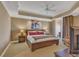 Bedroom featuring tray ceiling, a king bed, and access to a balcony at 9547 Edgerton Dr. # Ph1005, Myrtle Beach, SC 29572