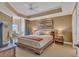 Bedroom featuring tray ceiling, a king bed, and access to a balcony at 9547 Edgerton Dr. # Ph1005, Myrtle Beach, SC 29572