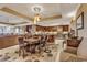 Open-concept kitchen and dining area with stainless steel appliances and dark wood cabinetry at 9547 Edgerton Dr. # Ph1005, Myrtle Beach, SC 29572