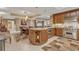 Open-concept kitchen and dining area with granite countertops and stainless steel appliances at 9547 Edgerton Dr. # Ph1005, Myrtle Beach, SC 29572