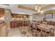 Open-concept kitchen and dining area featuring dark wood cabinetry and stainless steel appliances at 9547 Edgerton Dr. # Ph1005, Myrtle Beach, SC 29572