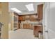 Well-lit kitchen features stainless steel appliances, tile backsplash, and wooden cabinetry at 9547 Edgerton Dr. # Ph1005, Myrtle Beach, SC 29572