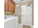 Functional laundry room features a washer, dryer, and storage cabinets at 9547 Edgerton Dr. # Ph1005, Myrtle Beach, SC 29572