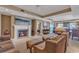 Open-concept living room with a fireplace and neutral tones at 9547 Edgerton Dr. # Ph1005, Myrtle Beach, SC 29572