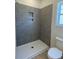 Contemporary bathroom featuring tiled shower, sleek fixtures, and stylish vanity at 994 Oak Hollow St., Longs, SC 29568