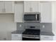 Modern kitchen featuring stainless steel appliances, and white cabinets at 994 Oak Hollow St., Longs, SC 29568