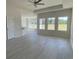 Bright living room space featuring sleek vinyl flooring and lots of natural light at 994 Oak Hollow St., Longs, SC 29568