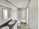 Well-lit bathroom featuring a double sink vanity, modern fixtures, and a shower-tub combination at 1455 Francis Marion Dr., Georgetown, SC 29440