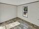 This bedroom features sleek wood flooring, a window, and neutral wall color at 1455 Francis Marion Dr., Georgetown, SC 29440