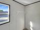 Walk-in closet featuring white shelving and one window, providing ample space at 1455 Francis Marion Dr., Georgetown, SC 29440