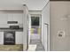 Inviting entryway view towards the front door with a view of the kitchen and appliances at 1455 Francis Marion Dr., Georgetown, SC 29440