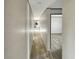 Hallway with gray wood floors leads to other rooms and highlights the house's open layout at 1455 Francis Marion Dr., Georgetown, SC 29440