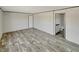 This main bedroom features sleek wood flooring, a window, and ensuite bathroom at Francis Marion Dr., Georgetown, SC 29440