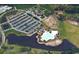 Aerial view of community with pool, parking, clubhouse and surrounding green space at 1007 Brood Ct., Conway, SC 29526