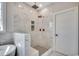 Spa-like bathroom with tiled walk-in shower featuring dual showerheads, a soaking tub, and natural light at 1007 Brood Ct., Conway, SC 29526