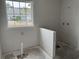 Bright unfinished bathroom with window and plumbing for fixtures at 1007 Brood Ct., Conway, SC 29526