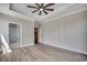 Elegant bedroom featuring a tray ceiling, decorative wall paneling, and luxury vinyl plank flooring at 1007 Brood Ct., Conway, SC 29526