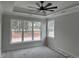 Bedroom with tray ceiling, large window, and ceiling fan at 1007 Brood Ct., Conway, SC 29526