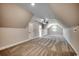 Expansive bonus room with a plush carpet, ceiling fan, neutral walls, and natural light coming through a window at 1007 Brood Ct., Conway, SC 29526