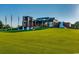 Stunning community clubhouse with modern architecture, expansive windows and manicured lawn at 1007 Brood Ct., Conway, SC 29526