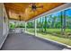 Scenic view of the backyard from a covered patio, showcasing a grill and lush greenery perfect for outdoor enjoyment at 1007 Brood Ct., Conway, SC 29526