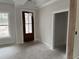 Bright entryway featuring a dark wood door, white trim, and natural light at 1007 Brood Ct., Conway, SC 29526