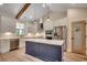 Modern kitchen featuring white cabinets, stainless steel appliances, an island with a dark base, and hardwood floors at 1007 Brood Ct., Conway, SC 29526