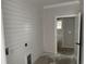 View of the laundry room featuring white shiplap and doorway leading to other rooms at 1007 Brood Ct., Conway, SC 29526