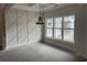 Living room with a large window and decorative wall paneling at 1007 Brood Ct., Conway, SC 29526