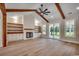 Cozy living room with a fireplace, built-in shelving, hardwood floors, and sliding glass doors to the backyard at 1007 Brood Ct., Conway, SC 29526