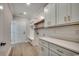 Organized mudroom with built-in storage, white cabinets, wood shelves, and a convenient bench at 1007 Brood Ct., Conway, SC 29526
