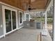 Covered outdoor kitchen featuring a built-in grill, stainless steel appliances, and wood ceiling at 1007 Brood Ct., Conway, SC 29526