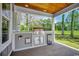 An outdoor kitchen features a grill, cabinetry, and counter space, ideal for cooking and entertaining in the open air at 1007 Brood Ct., Conway, SC 29526
