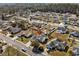 Aerial view of a neighborhood featuring many homes, tree-lined streets, and well-maintained lawns at 1021 Dunraven Ct., Conway, SC 29527