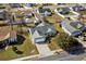 Aerial view of a home showcasing roof, attached garage, driveway, and the surrounding neighborhood at 1021 Dunraven Ct., Conway, SC 29527