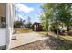 Backyard with a concrete patio, a small wooden shed, landscaping rocks and green lawn at 1021 Dunraven Ct., Conway, SC 29527