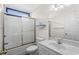 Well-lit bathroom featuring a tub/shower combo with sliding glass door and a white vanity at 1021 Dunraven Ct., Conway, SC 29527