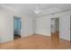 Large bedroom with wood floors leading to an en-suite bathroom and access to kitchen at 1021 Dunraven Ct., Conway, SC 29527